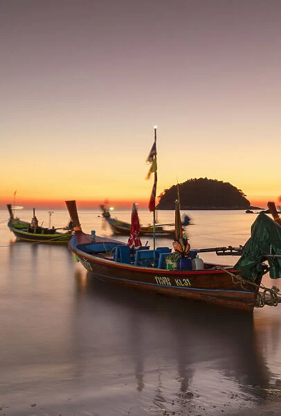 Long tail boats on Kata Beach at sunset, Phuket, Thailand