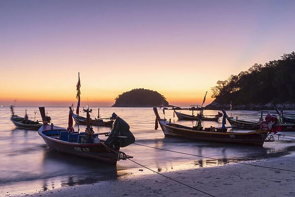 Long tail boats on Kata Beach at sunset, Phuket, Thailand