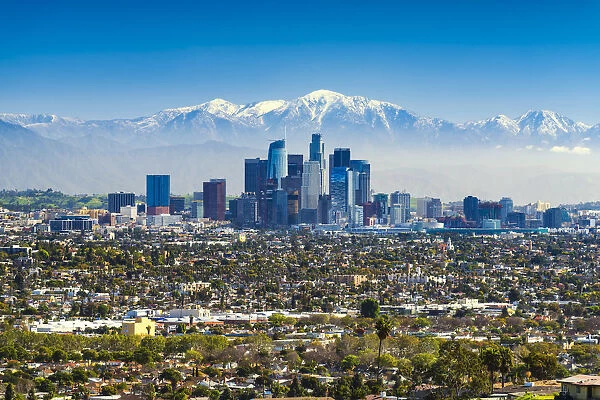 Los Angeles Skyline and Snow Capped San Gabriel Mountains, California, USA