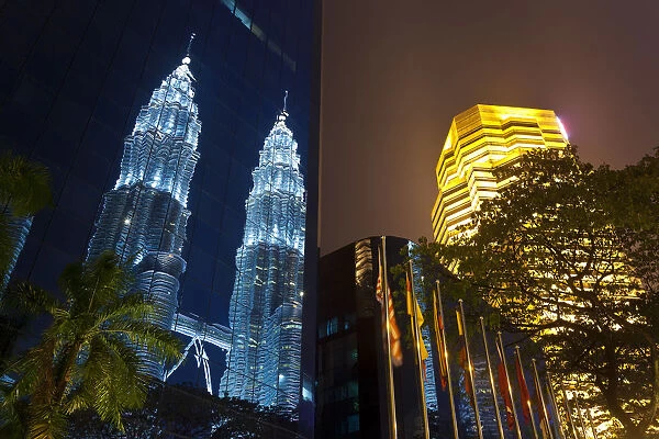 Low angle reflected iew of the Petronas Twin Towers, Kuala Lumpur, Malaysia