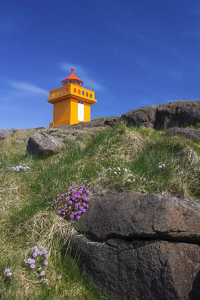 Low angle view of lighthouse on cliff at Djupivogur, East Iceland, Iceland