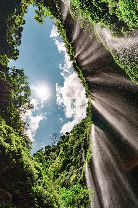 Framed Print : Low angle view of water cascades down the lush towering walls of Madakaripura waterfall, Bromo, East Java, Indonesia Framed Print : Low angle view of water cascades down the lush towering walls of Madakaripura waterfall, Bromo, East Java, Indonesia