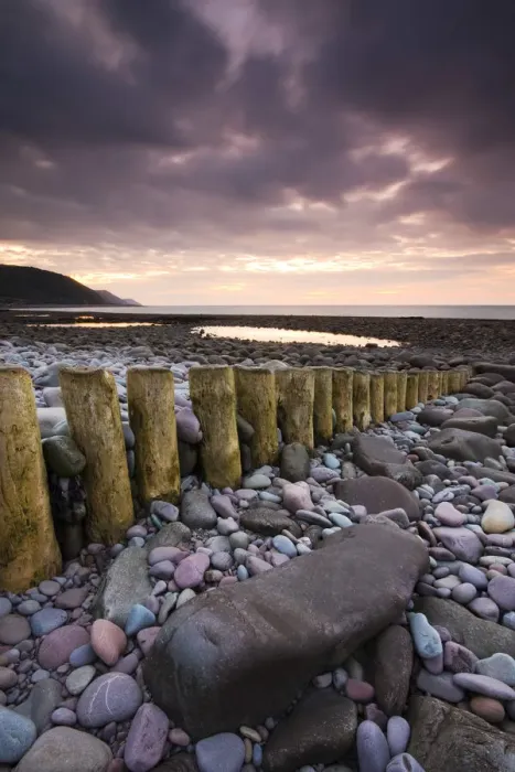 Framed Print : Low tide on Bossington Beach at sunset, Exmoor National Park, Somerset, England. Summer