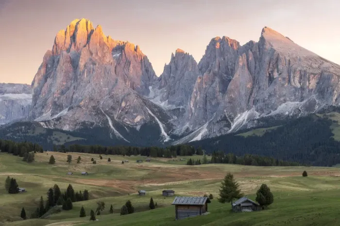Framed Print : Lush green meadows and some old cabins create the classic alpine landscape at the Alpe di Siusi (Seiser Alm), with the Sassolungo and Sassopiatto taking the last light in the background. Dolomites, Italy Framed Print : Lush green meadows and some old cabins create the classic alpine landscape at the Alpe di Siusi (Seiser Alm), with the Sassolungo and Sassopiatto taking the last light in the background. Dolomites, Italy