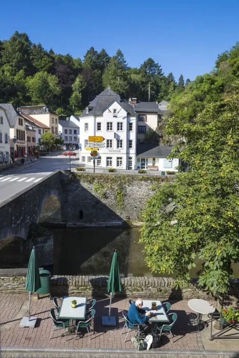 Framed Print : Luxembourg, Vianden, Man sitting at riverside cafe Framed Print : Luxembourg, Vianden, Man sitting at riverside cafe