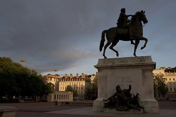 Lyon, France; Statue of Louis XIV and Basilique Notre Dame de Fourviere Place Bellecour