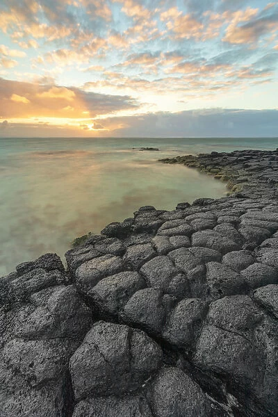 a magical sunrise whit basaltic stone, Trou d Eau Douce, Mauritius, Indian Ocean