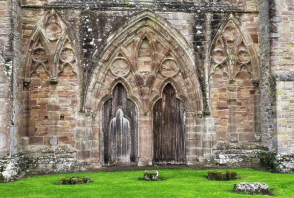 The main entrance in the west facade of the Tintern Abbey church, founded in 1131 by Cistercian monks, Monmouthshire, Wales