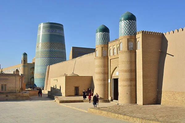 The main gate to the Khuna Ark citadel and the Kalta Minor minaret. Old town of Khiva