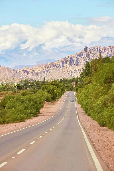 The main road of the 'Quebrada de Humahuaca' with the mountains in background, Tilcara, Jujuy, Northwest Argentina