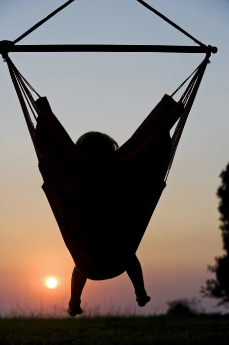 Framed Print : Malawi, Lake Malawi National Park. Young guest relaxes in a hammock at Pumulani Lodge Framed Print : Malawi, Lake Malawi National Park. Young guest relaxes in a hammock at Pumulani Lodge