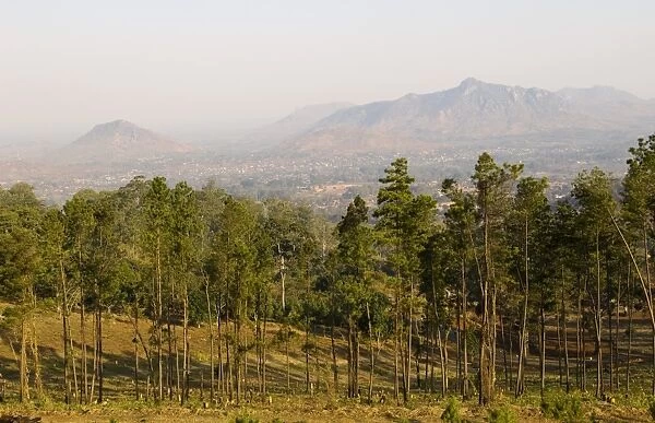 Malawi, Zomba. View over the town of Zomba from the lower slopes of Zomba Plateau where once there was dense