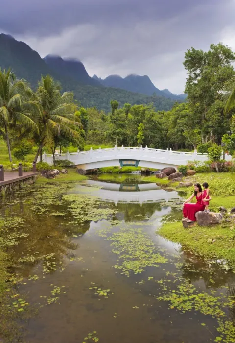 Framed Print : Malaysia, Langkawi, Oriental Gardens, Woman and girl sitting by lake MR Framed Print : Malaysia, Langkawi, Oriental Gardens, Woman and girl sitting by lake MR