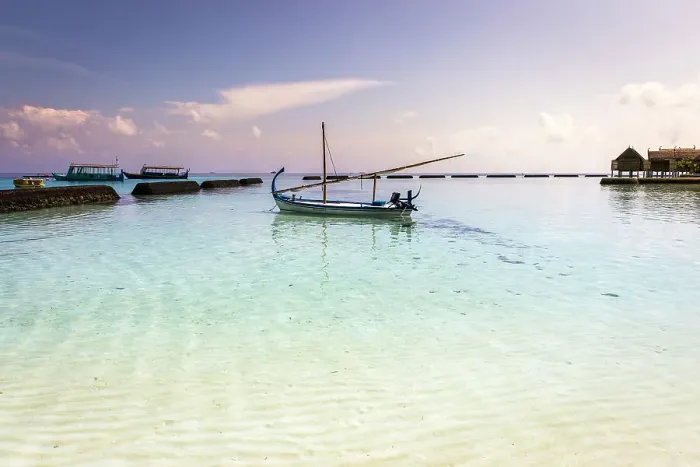 Framed Print : Maldives, Ari Atoll, Constance Moofushi Maldives, A boat in the beach