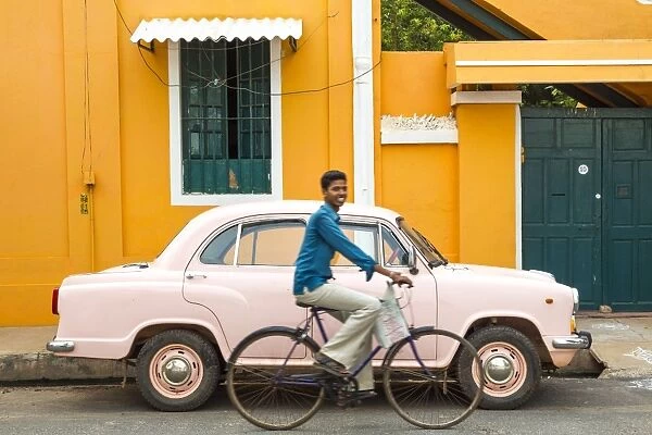 Male cyclist and Ambassador car, Pondicherry (Puducherry), Tamil Nadu, India