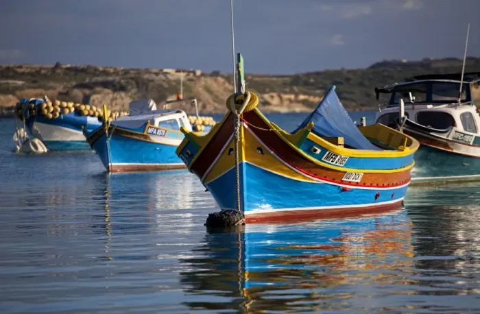 Framed Print : Malta, Europe; Colourful traditional Maltese boats known locally as luzzu in the village of Marsaxlokk which is still based around the fishing industry. The boats have two eyes in the bow which according to legend might represent those Framed Print : Malta, Europe; Colourful traditional Maltese boats known locally as luzzu in the village of Marsaxlokk which is still based around the fishing industry. The boats have two eyes in the bow which according to legend might represent those