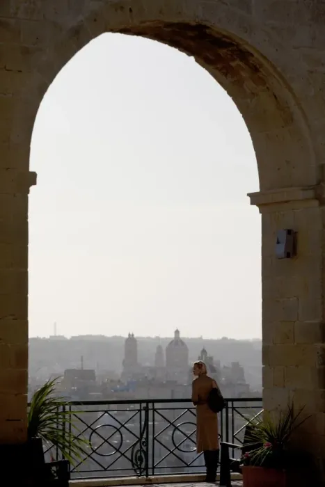 Framed Print : Malta, Europe; A tourist enjoying the scenery of the three cities from the Upper Barracca Gardens in Framed Print : Malta, Europe; A tourist enjoying the scenery of the three cities from the Upper Barracca Gardens in