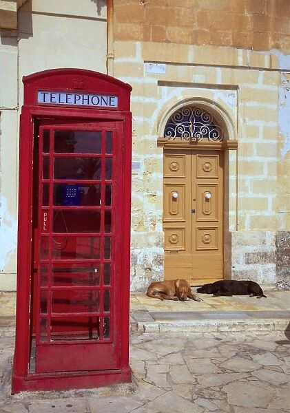 Malta, Marsaxlokk, Europe; Reminiscent of a bygone era, the island is still full of telephone boxes dating back to the