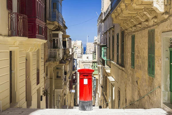 Malta, South Eastern Region, Valletta. An old British style post box in a traditional