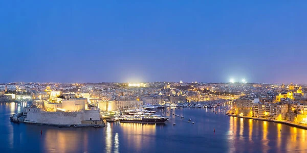 Malta, South Eastern Region, Valletta. Grand Harbour and the Three Cities at dusk