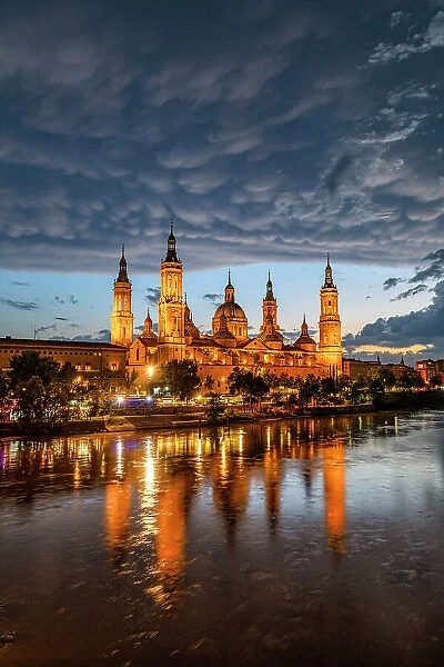 Mammatus Clouds over Cathedral-Basilica of Our Lady of the Pillar Reflecting in the Ebro River, Zaragoza, Aragon, Spain