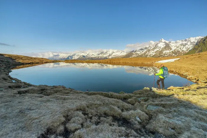 Framed Print : Man at Andossi Lake over Splugenpass at sunrise, Sondrio, Grigioni, Lombardy, Italy (MR) Framed Print : Man at Andossi Lake over Splugenpass at sunrise, Sondrio, Grigioni, Lombardy, Italy (MR)