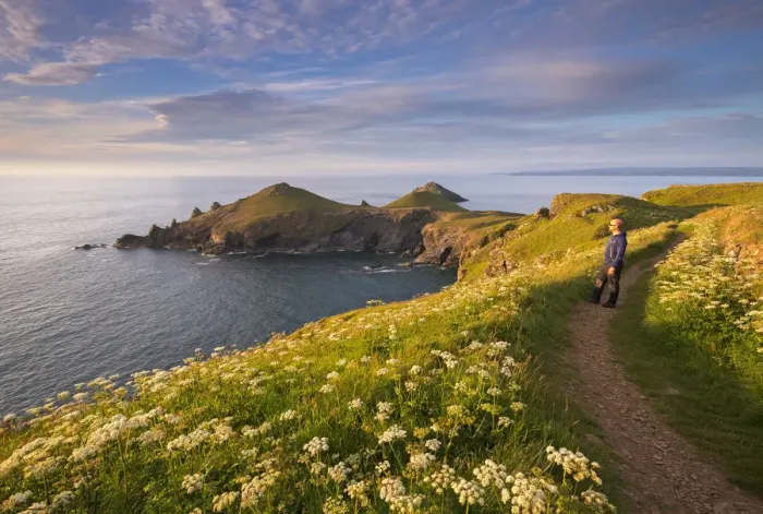 Framed Print : Man appreciating the beautiful coastal view at The Rumps, North Cornwall, England Framed Print : Man appreciating the beautiful coastal view at The Rumps, North Cornwall, England
