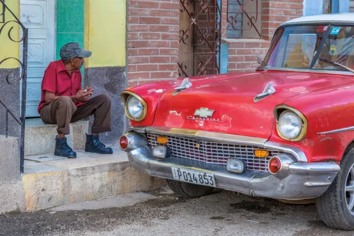 Framed Print : Man and classic American vintage car in Trinidad, Trinidad and Sancti Spiritus Province Framed Print : Man and classic American vintage car in Trinidad, Trinidad and Sancti Spiritus Province