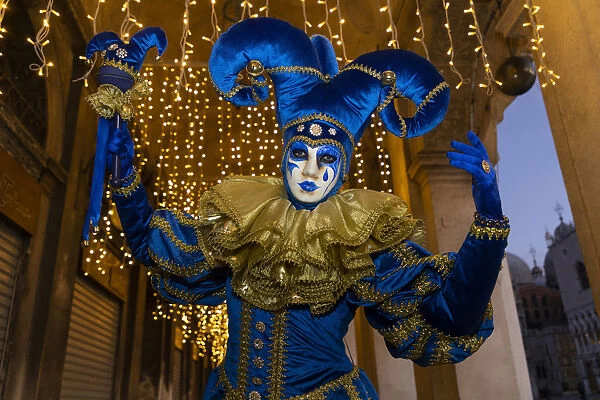 A man dressed as a joker poses during the Venice Carnival, Venice, Veneto, Italy
