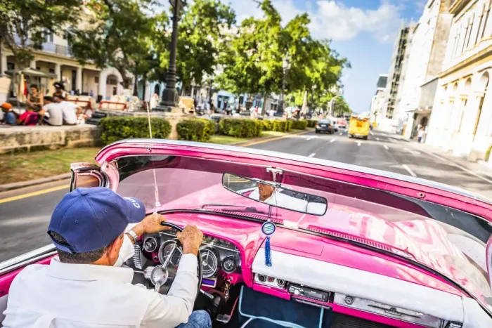 Framed Print : A man driving a classic car in Centro Habana District, Havana, Cuba Framed Print : A man driving a classic car in Centro Habana District, Havana, Cuba