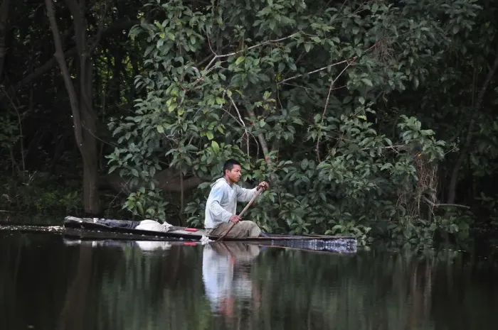 Framed Print : Man in a dugout canoe on the Amazon River, near Puerto Narino, Colombia Framed Print : Man in a dugout canoe on the Amazon River, near Puerto Narino, Colombia