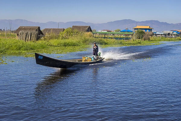 Man going on Inle Lake by boat, Lake Inle, Nyaungshwe Township, Taunggyi District