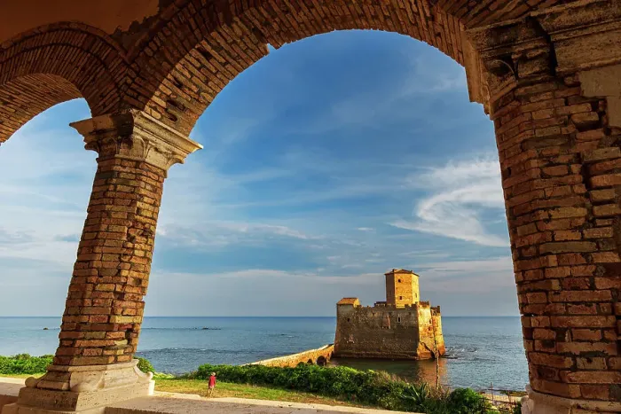 Framed Print : Man in green field admires the medieval castle of Torre Astura at sunset, Nettuno municipality, Rome province, Latium, Tyrrhenian sea, Italy (MR) Framed Print : Man in green field admires the medieval castle of Torre Astura at sunset, Nettuno municipality, Rome province, Latium, Tyrrhenian sea, Italy (MR)