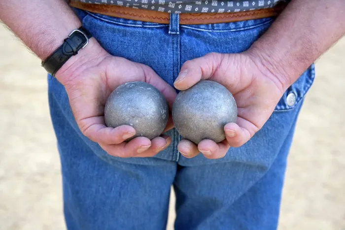 Framed Print : A man holds two boules whilst he plays petanque, Dordogne, Nouvelle-Aquitaine, France Framed Print : A man holds two boules whilst he plays petanque, Dordogne, Nouvelle-Aquitaine, France