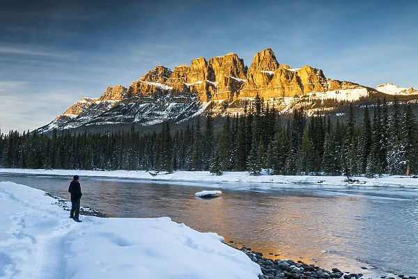 Man Looking at Castle Mountain at Sunset, Banff National Park, Aberta, Canada