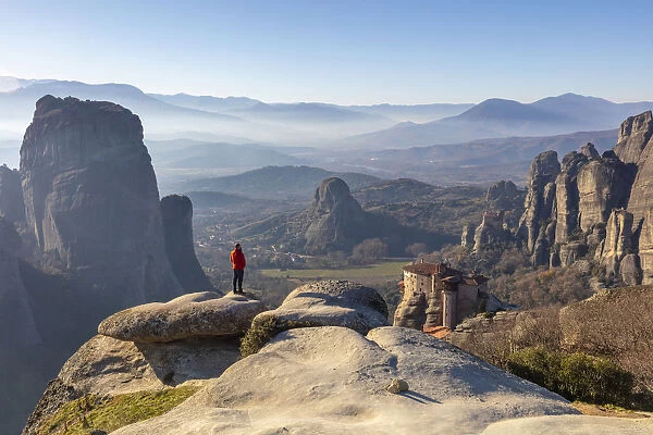 A man looks at the view above Rousanou Monastery, Meteora, Thessaly, Greece