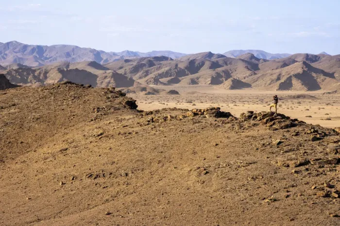 Framed Print : Man on a mountain, Skeleton Coast National Park, Namibia Framed Print : Man on a mountain, Skeleton Coast National Park, Namibia