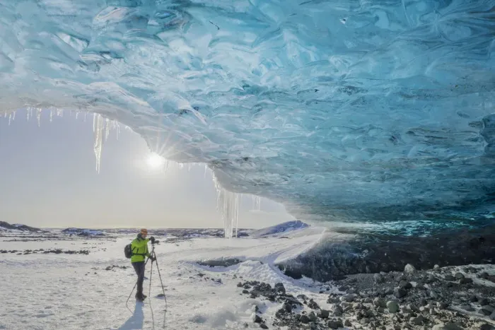 Framed Print : Man photographs an ice cave of Breidamerkurjokull, Austurland, Iceland