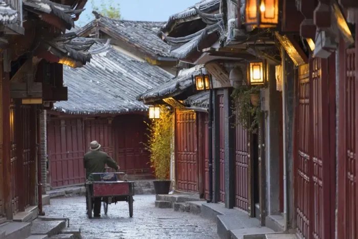 Framed Print : Man pushing bicycle along alleyway, Lijiang (UNESCO World Heritage Site), Yunnan, China Framed Print : Man pushing bicycle along alleyway, Lijiang (UNESCO World Heritage Site), Yunnan, China
