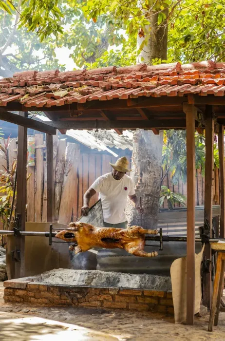 Framed Print : A man roasting a pig in a restaurant in Trinidad, Sancti Spiritus, Cuba Framed Print : A man roasting a pig in a restaurant in Trinidad, Sancti Spiritus, Cuba