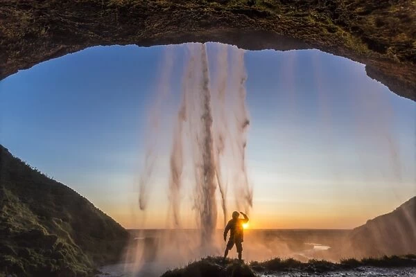 Man behind Seljalandsfoss Waterfall, Suourland (South Iceland), Iceland