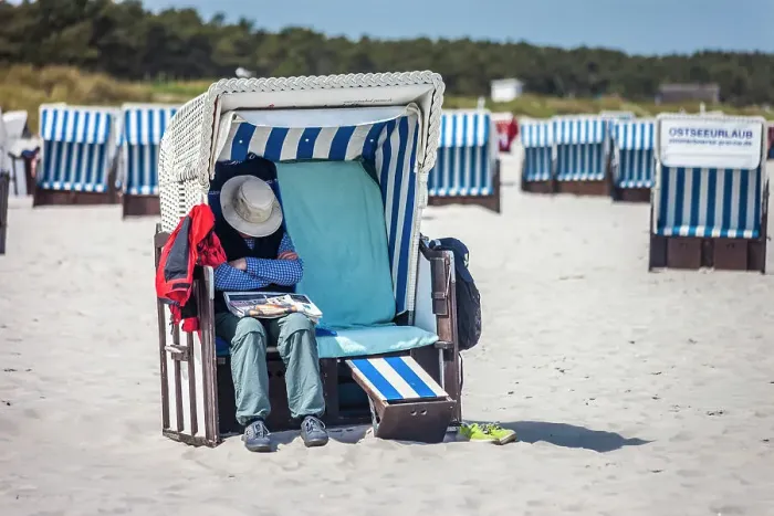 Framed Print : Man sleeping in a beach chair on the beach at Zingst, Mecklenburg-Western Pomerania, Baltic Sea, Northern Germany, Germany