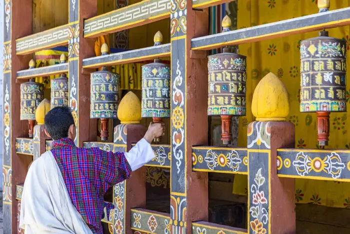 Framed Print : A man spinning prayer wheels in Trongsa Dzong, Trongsa District, Bhutan Framed Print : A man spinning prayer wheels in Trongsa Dzong, Trongsa District, Bhutan