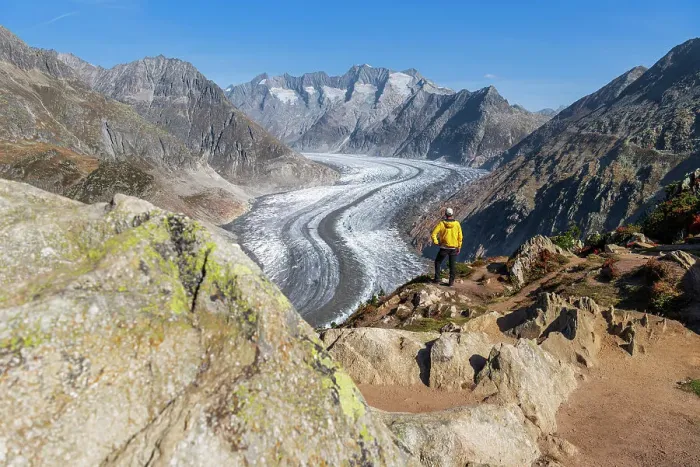 Framed Print : Man standing on top of a rock observing the alpine landscape of the Aletsch glacier, Moosfluh, Bernese Alps, Valais canton, Switzerland (MR) Framed Print : Man standing on top of a rock observing the alpine landscape of the Aletsch glacier, Moosfluh, Bernese Alps, Valais canton, Switzerland (MR)