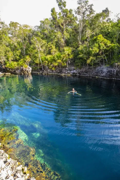 Framed Print : A man swimming in a natural water swiming pool in Playa Giron, Bay of Pigs