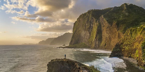 Man taking pictures at dawn. Faial, Santana municipality, Madeira Island, Portugal. (MR)