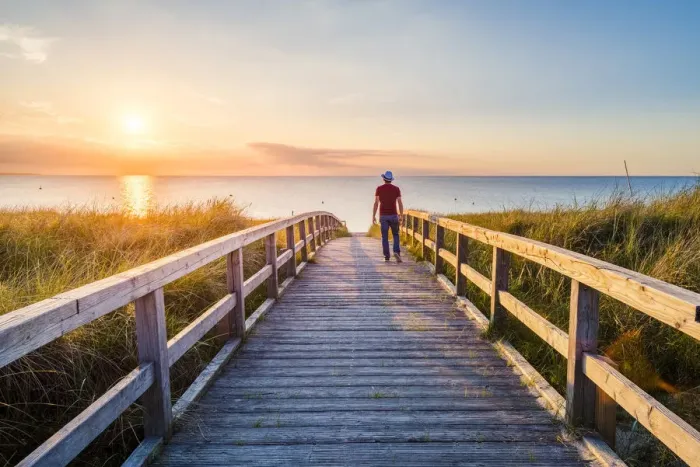 Framed Print : Man walking on a footbridge to Weissenhaauser Strand, Ostholstein, Schleswig-Holstein Framed Print : Man walking on a footbridge to Weissenhaauser Strand, Ostholstein, Schleswig-Holstein