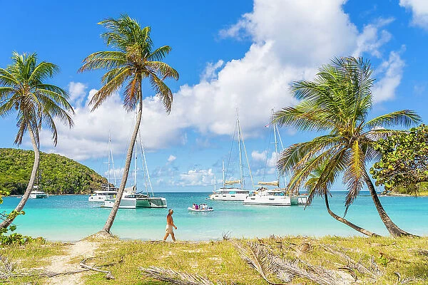 A man walking on Mayreau Island, in the Tobago Cays in the Grenadines Islands, Saint Vincent and the Grenadines, Caribbean
