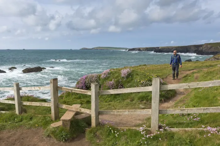 Framed Print : Man walking the South West Coast Path near Trevose Head, Cornwall, England. Spring Framed Print : Man walking the South West Coast Path near Trevose Head, Cornwall, England. Spring