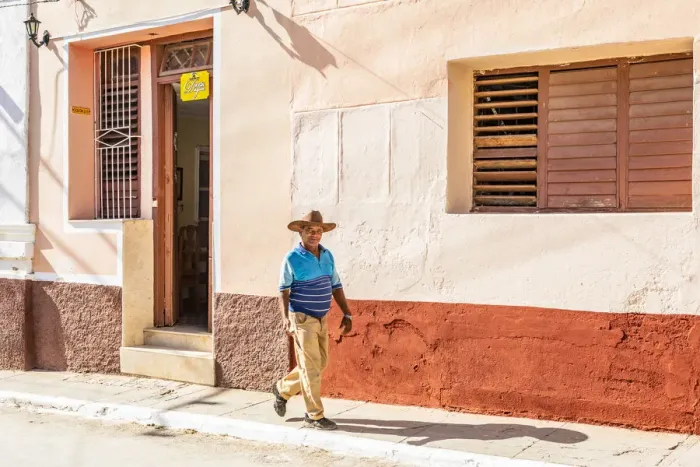 Framed Print : A man walking in a street in Trinidad, Sancti Spiritus, Cuba Framed Print : A man walking in a street in Trinidad, Sancti Spiritus, Cuba